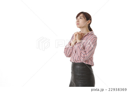 お祈りポーズの写真素材