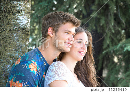 Loving bride kissing her charming huband. They wear wedding robes