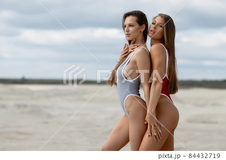 Naked women in panties hugging on beach - Stock Photo [84277115] - PIXTA