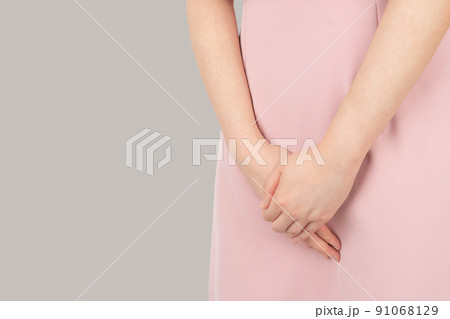 Hands Woman Holding Her Crotch And Lying On Bed,Female Need To Pee