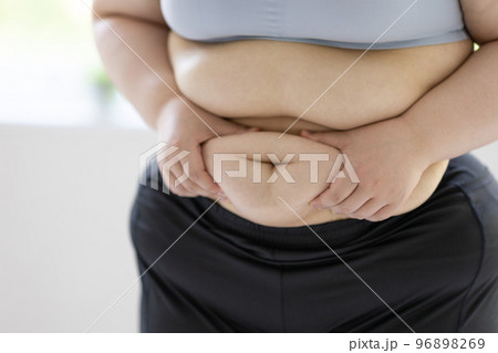 A Blonde With Long Hair In Black Underwear Is Lying On The Bed