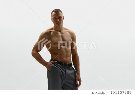 Black and White Portrait of Muscular Man with Wide Back Posing