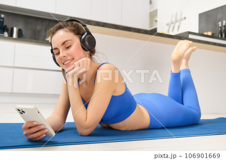 Fitness, yoga and gym at home concept. Young woman doing