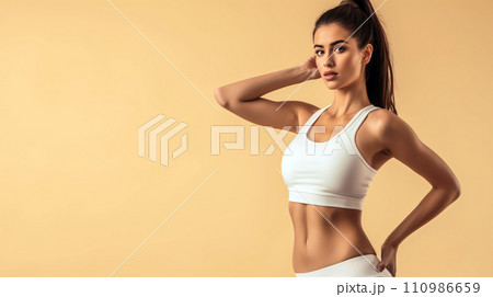 African American girl in gym outfit, holding a yoga mat. Beautiful